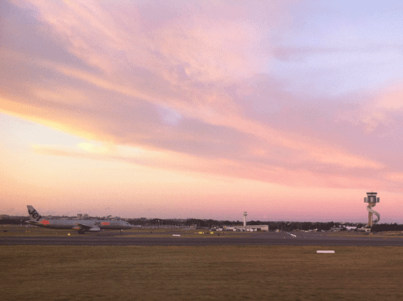 Jetstar A320 SYD sunset ATC tower
