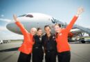 Jetstar cabin crew in front of a Dreamliner