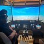 Andrew Newnham in the Boeing 747 flight simulator he built in his garage