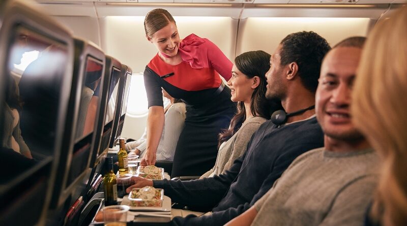 Inflight economy cabin passengers are getting food served in Qantas A330