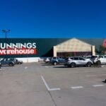The Bunnings Warehouse hardware chain store in North Mackay, Queensland, Australia with a large carpark in front of it with customer cars.