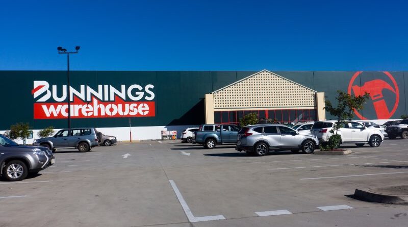 The Bunnings Warehouse hardware chain store in North Mackay, Queensland, Australia with a large carpark in front of it with customer cars.