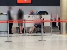 Qantas has "enhanced" the experience for customers at the airport forced to wait hours to speak to the call centre by giving them a chair to sit on while they wait