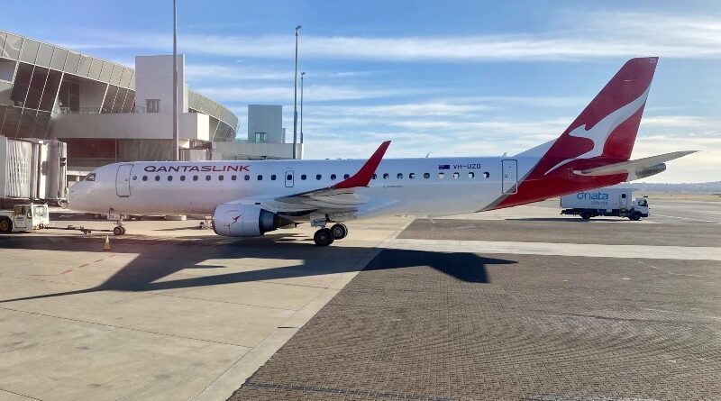 QantasLink Embraer E190 at Canberra Airport with dnata catering truck