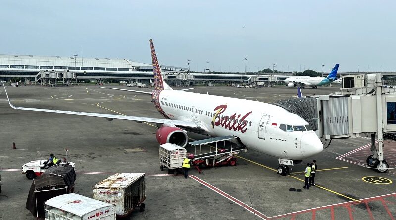 A Batik Air Indonesia Boeing 737-800 with Garuda Indonesia plane in background at CGK
