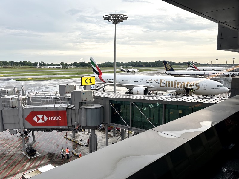 An Emirates Boeing 777 as seen from the Emirates Lounge in Singapore