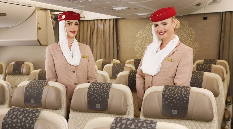 Emirates flight attendants show off the airline's new A380 Premium Economy cabin