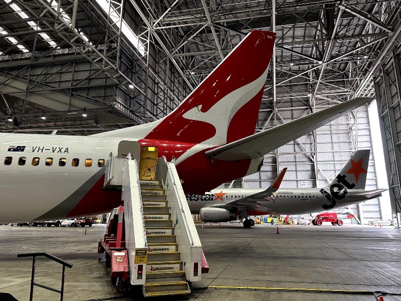 A Qantas Boeing 737 and Jetstar A320 in Hangar 96 at Sydney Airport