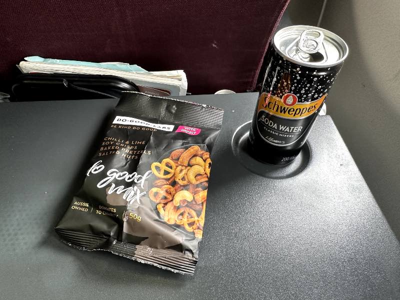 Nuts, pretzels and soda water in Qantas economy class