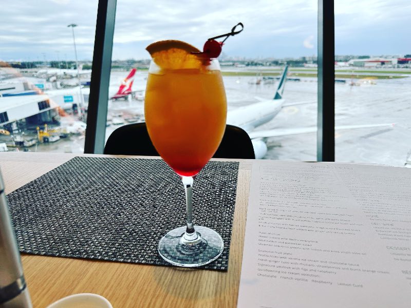 Tequila Sunrise cocktail in the Qantas First Lounge in Sydney