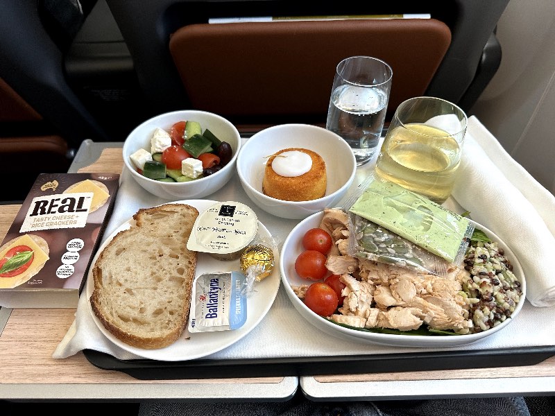 Chicken salad with ancient grains, spinach, cherry tomatoes and green goddess dressing for lunch in Qantas Premium Economy