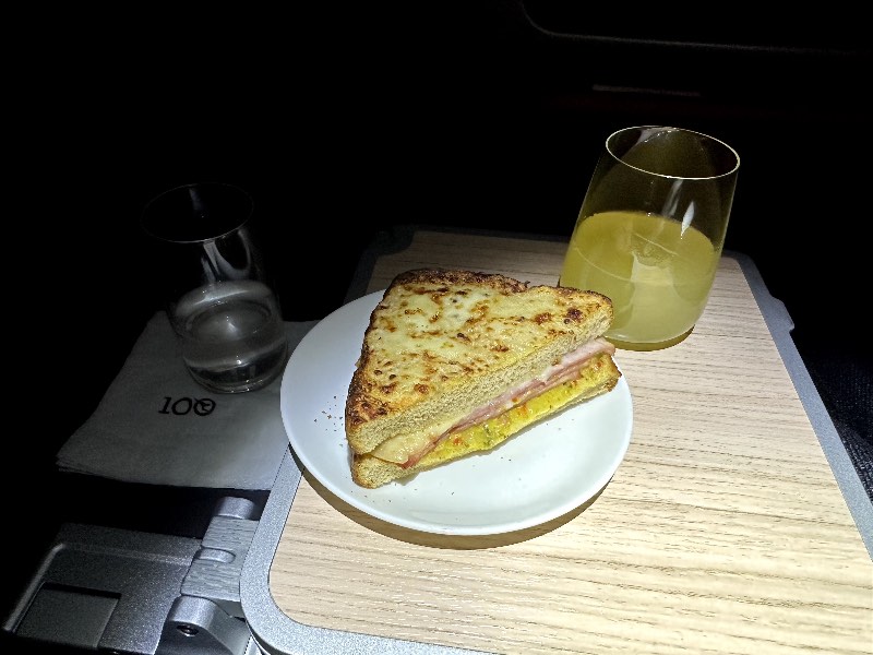 Mid-flight snack in Qantas Premium Economy: A Reuben grilled cheese toastie
