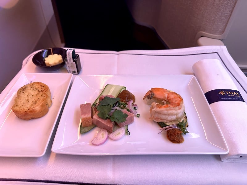 Thai-style spicy smoked duck salad and seared tiger prawn salad served as a Starter in Thai Airways business class