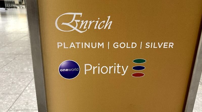 Oneworld Ruby, Sapphire and Emerald priority symbols on a Malaysia Airlines priority check-in sign