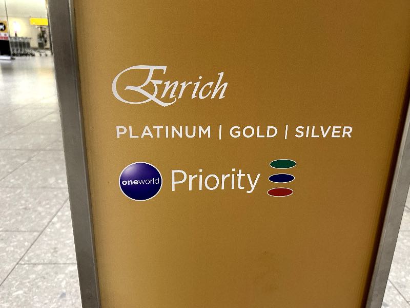 Oneworld Ruby, Sapphire and Emerald priority symbols on a Malaysia Airlines priority check-in sign