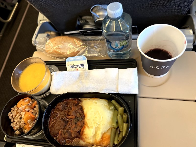 Braised beef with mustard, mash potato, greens and carrots in Etihad economy class