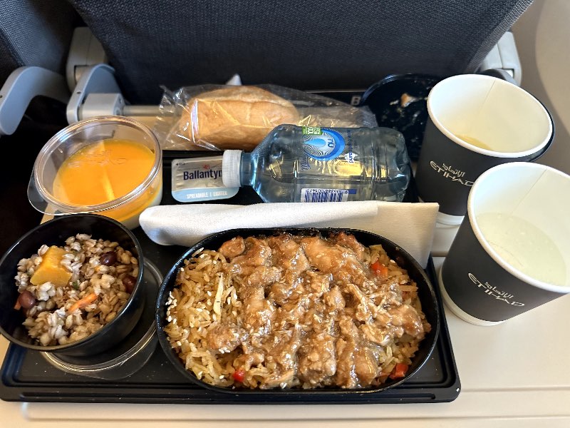 Soy chicken with nasi goreng, choy sum and toasted sesame seeds in Etihad economy class