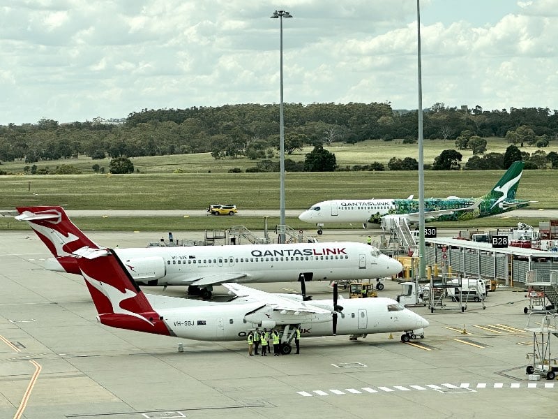 An Airbus A220, Boeing 717 and Bombardier Dash 8 at Melbourne Airport