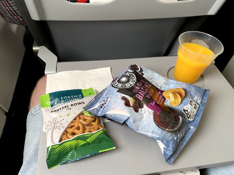Snack and orange juice on Link Airways in economy class
