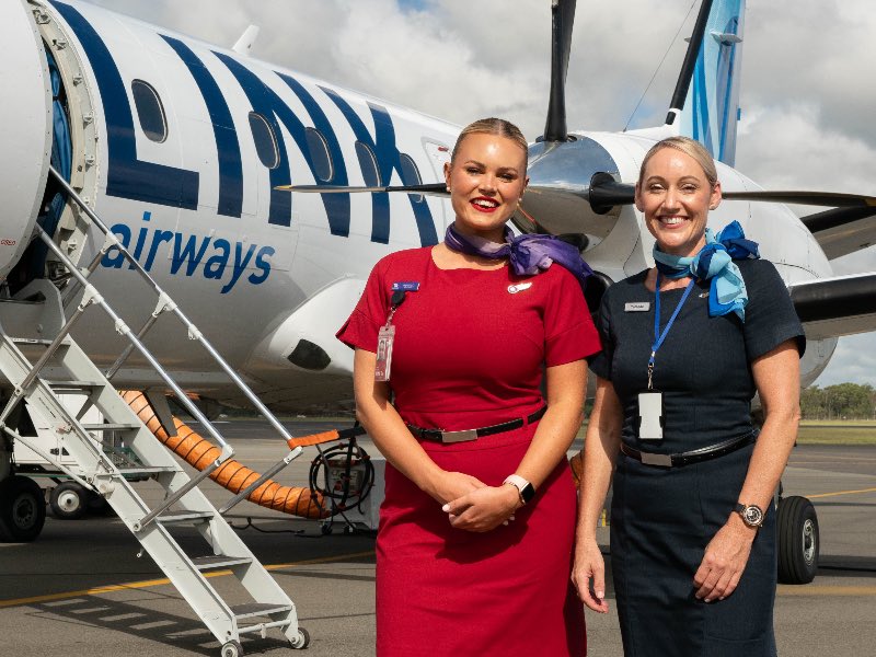 Virgin Australia and Link Airways flight attendants with a Link Saab 340