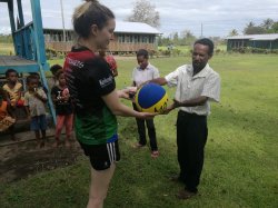 120 - Alisha presenting sports equip and educational packs to Buna school principal.jpg
