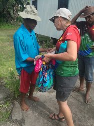 130 - Lisa presenting the Buna medical  centre doctor with medical supplies.jpg