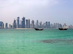 Doha downtown from Corniche and dhows.jpg