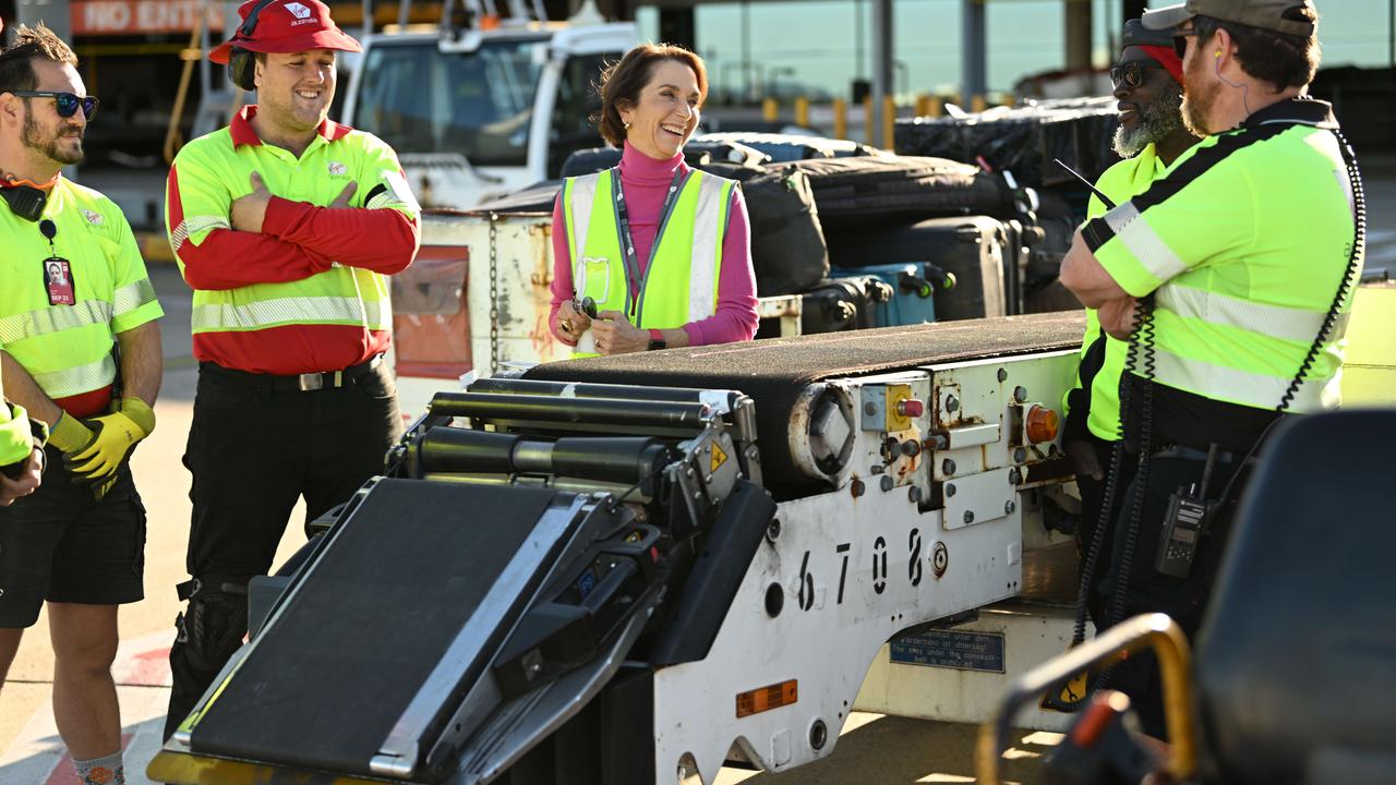 Jayne Hrdlicka talks to ground staff airside at Brisbane Airport on Thursday. ‘We’re punching above our weight.’ Picture: Lyndon Mechielsen