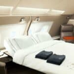 By paying tax by credit card, cove has been able to travel the world in the luxury of Singapore Airlines Suites