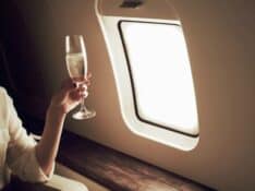 Drinking champagne on private jet