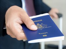 Businessman showing passport (of Australia)