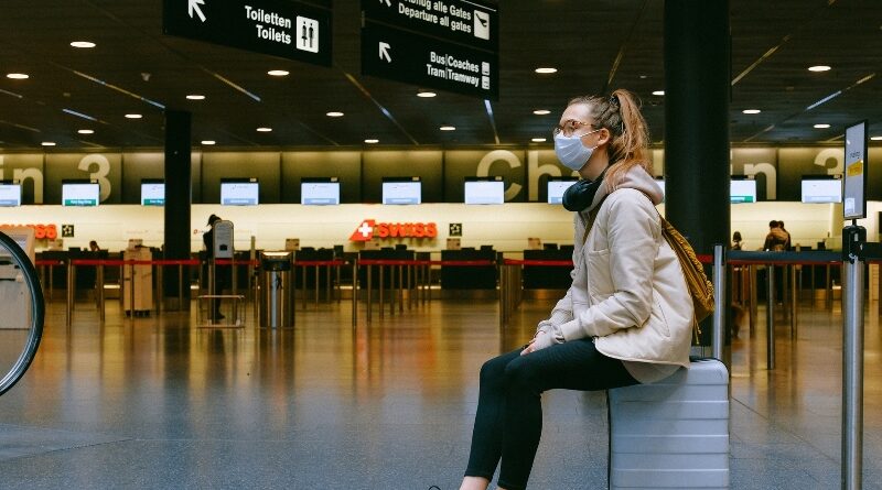 Woman at ZRH wearing mask Swiss checkin