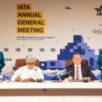 Oman Air CEO Eng Abdulaziz Al Raisi (seated, left) and oneworld CEO Rob Gurney (seated, right) sign the agreement for Oman Air to join oneworld in Doha at the IATA Annual General Meeting