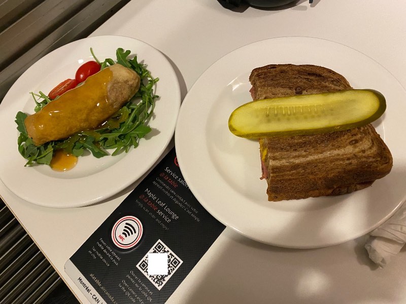 Montreal smoked meat sandwich and vegetable spring roll from the Air Canada lounge menu