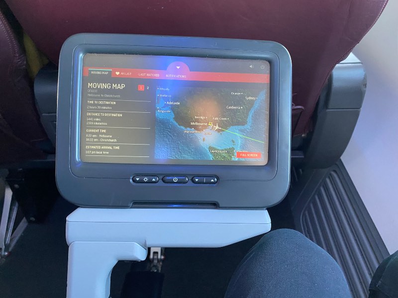 Fold-out entertainment screen in row 4 of Qantas 737 Economy Class
